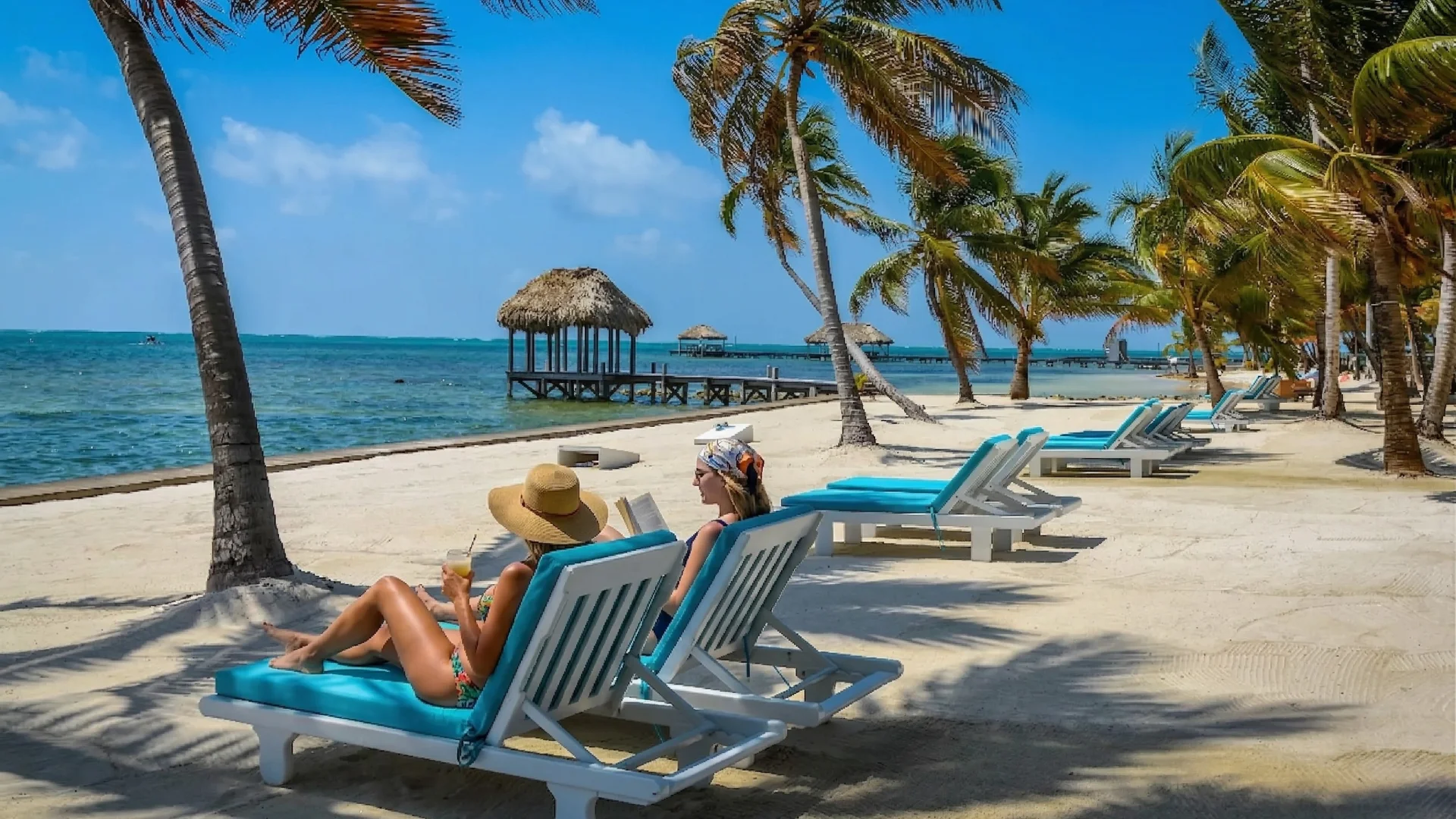 Aerial view of a stunning tropical island surrounded by turquoise Caribbean waters in Belize.